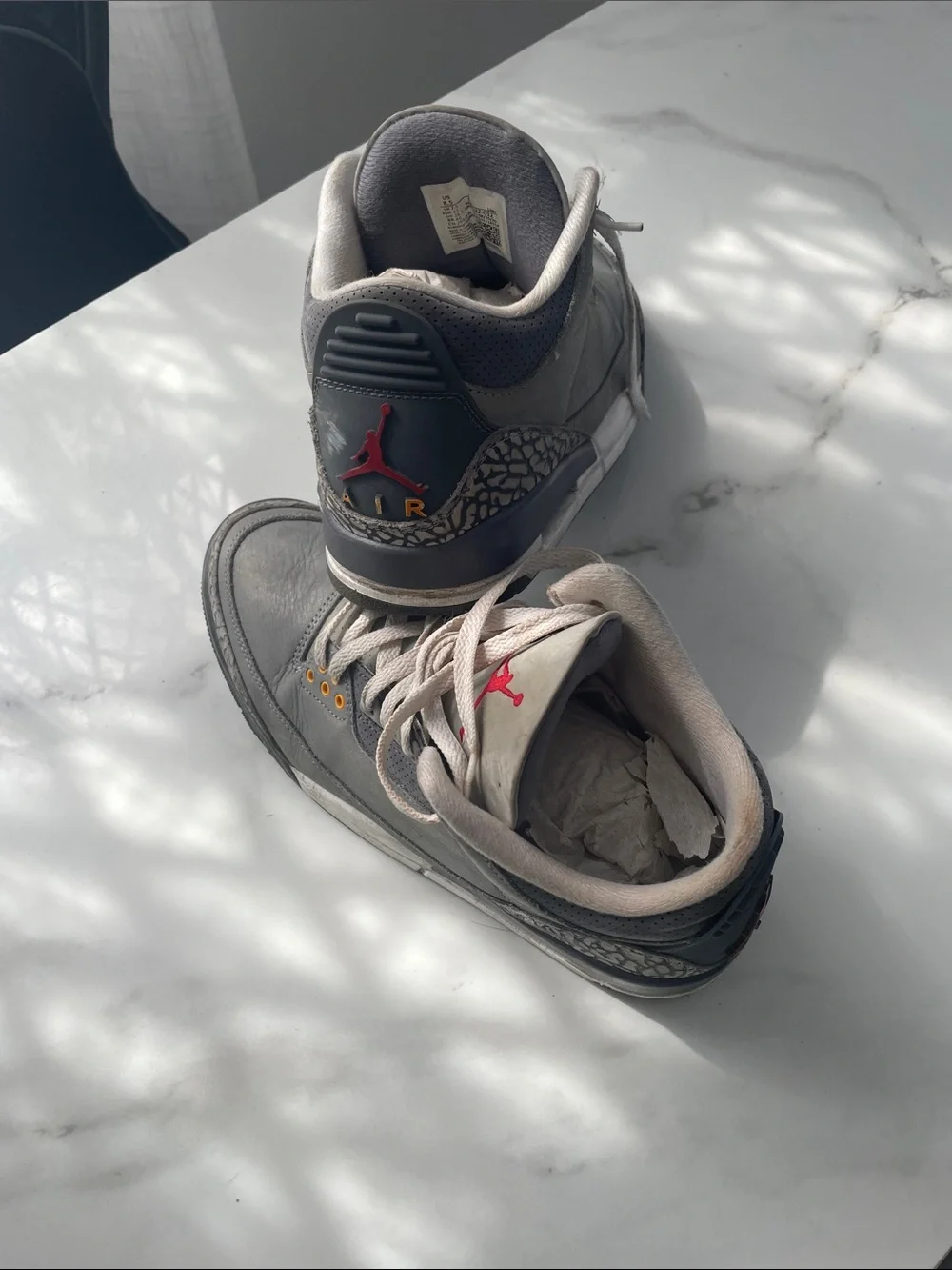 Jordan Gray and Black Retro Sneakers with Red Tongue Logo